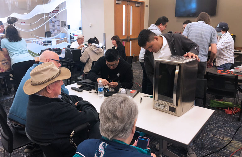 Fixers work on personal items at one of King County's Repair Events - sponsored by the King County EcoConsumer program