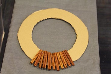 Making a cinnamon stick holiday wreath