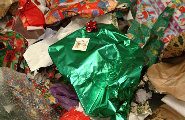 pile of used holiday wrapping paper