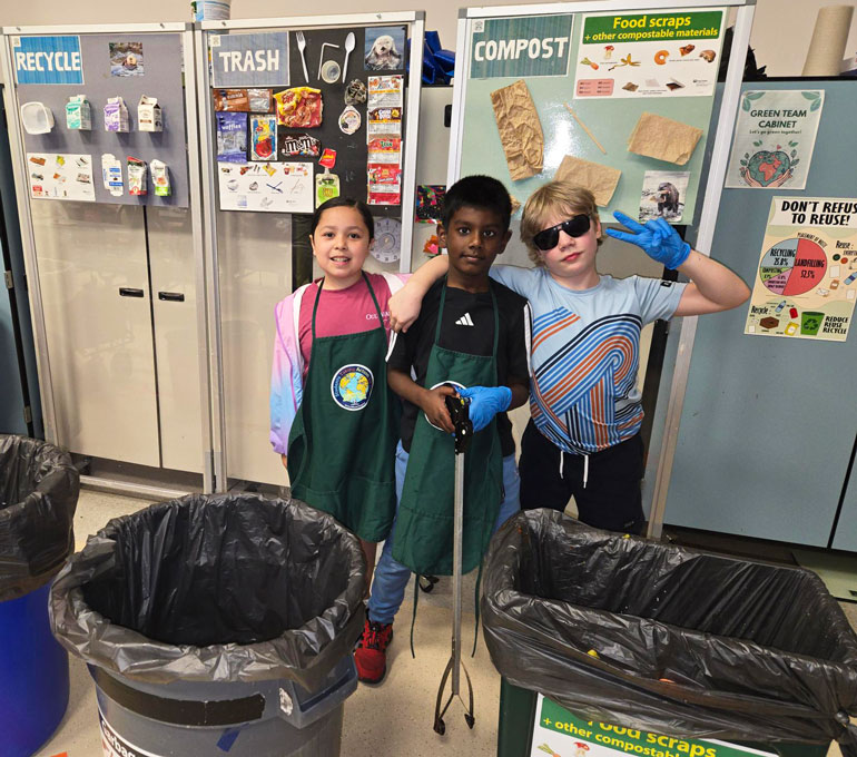 The Green Otters, a student team that monitors cafeteria waste stations at Albert Einstein Elementary