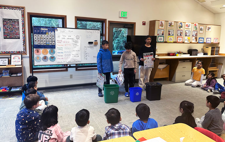 Students at Cascadia Montessori teach classrooms how to properly sort waste to make sure no contamination ends up in the recycling or organics bins.