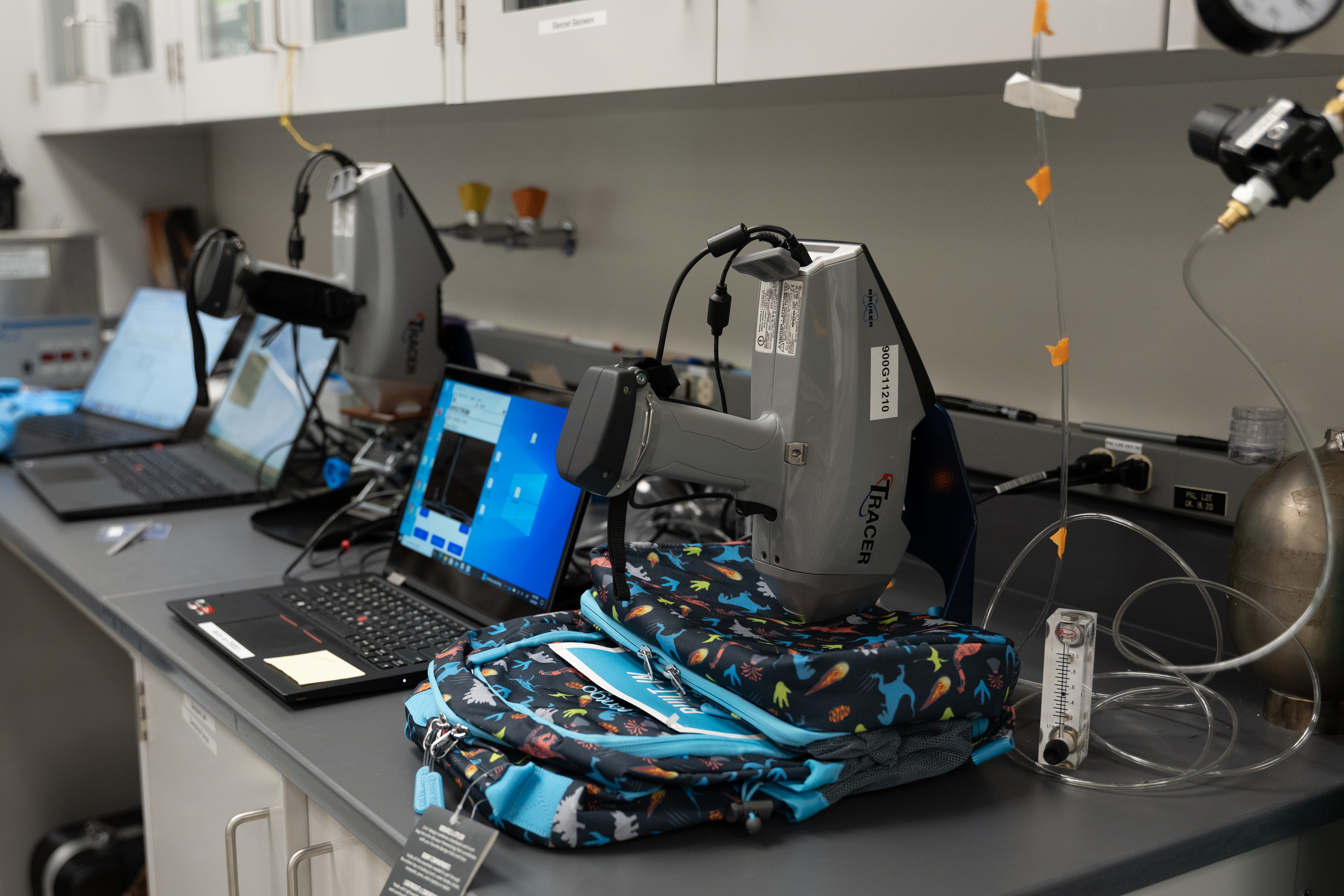 XRF machine testing backpack for signs of PFAS