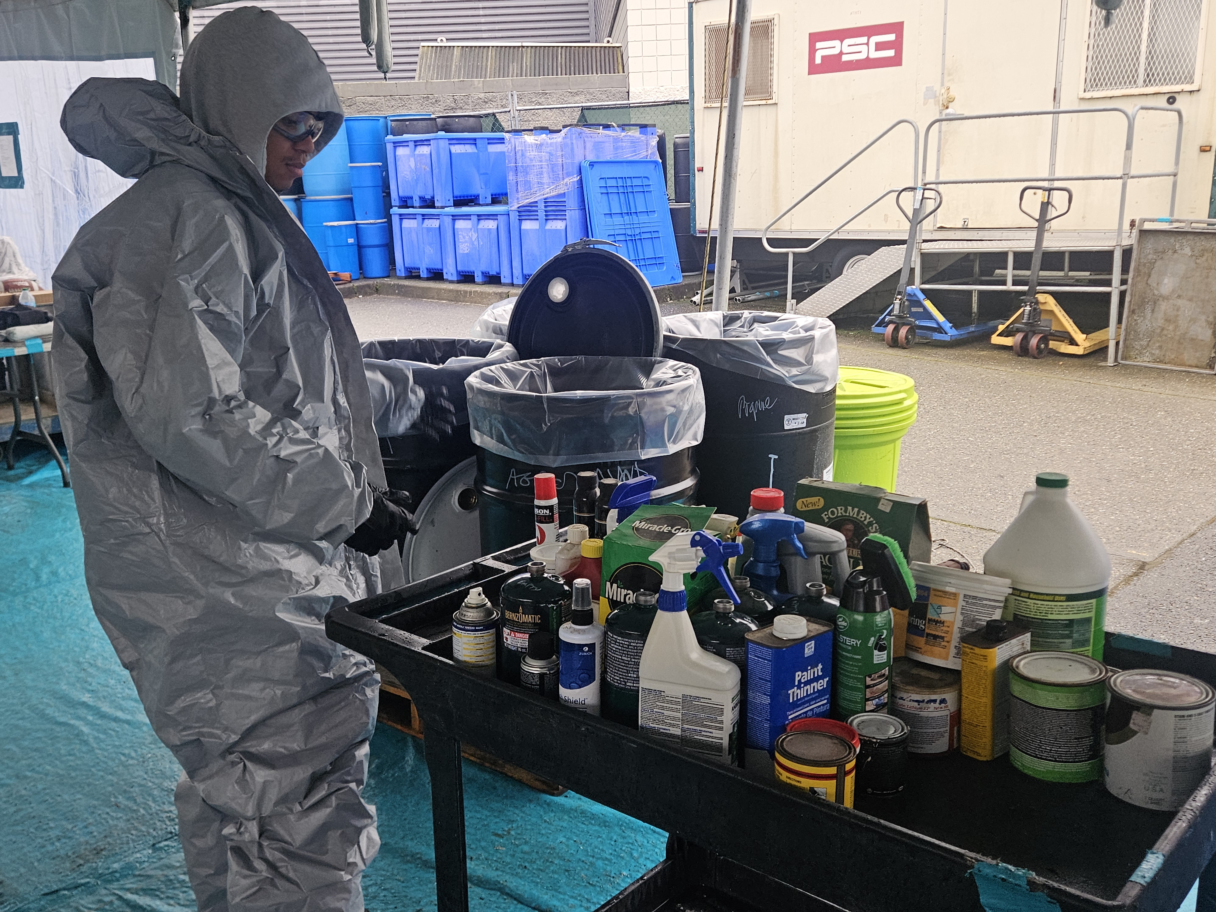 Wastemobile staff sorting items from customer drop off 