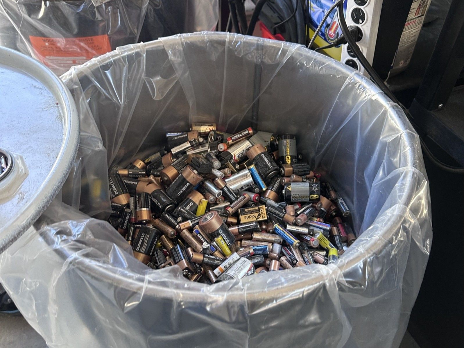 Household batteries in a round bucket