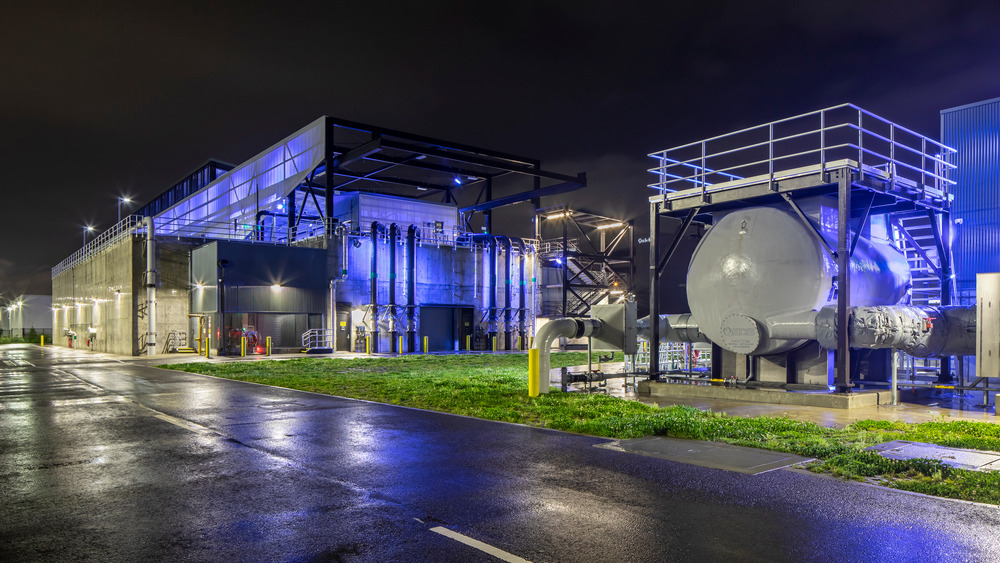 Georgetown wet weather station at night, blue lights illuminate the building.