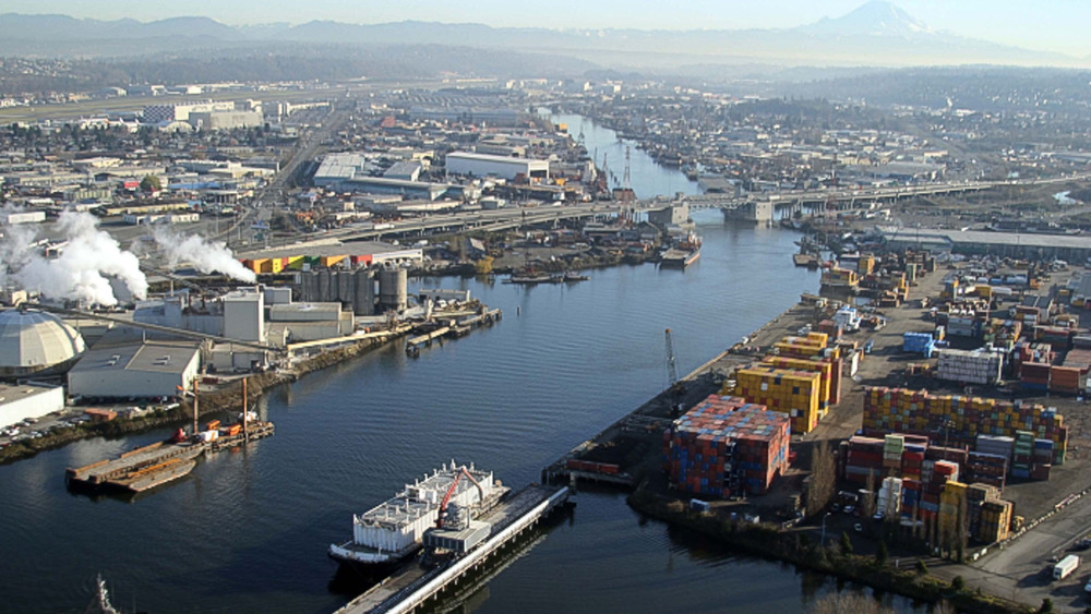 An aerial view of the lower Duwamish River with Mount Rainier in the background. 
