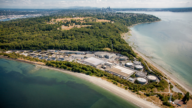 View of the West Point Treatment Plant looking southeast with downtown Seattle in the distance