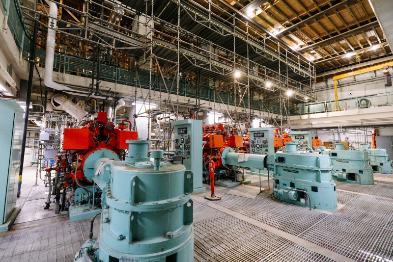 Teal sewage pumps inside of a large industrial building at the West Point Treatment Plant.