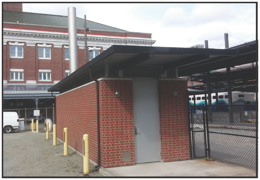 Small brick building next to the carbon scrubbers used to store equipment 
