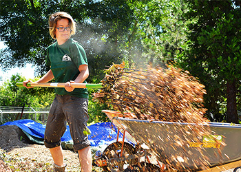 volunteer working at city soil farm