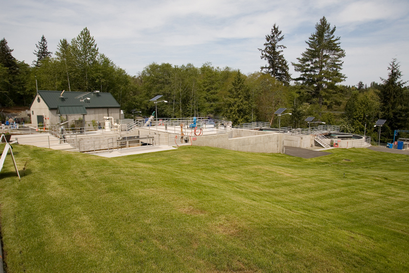 Vashon Treatment Plant nestled amongst trees and green grass