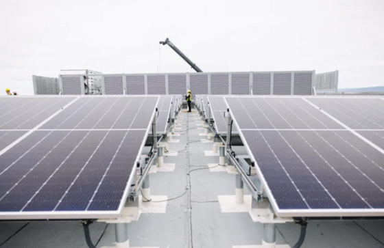 A row of solar panels on top of the power quality improvement building at West Point Treatment Plant