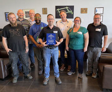 Group of people receiving an award
