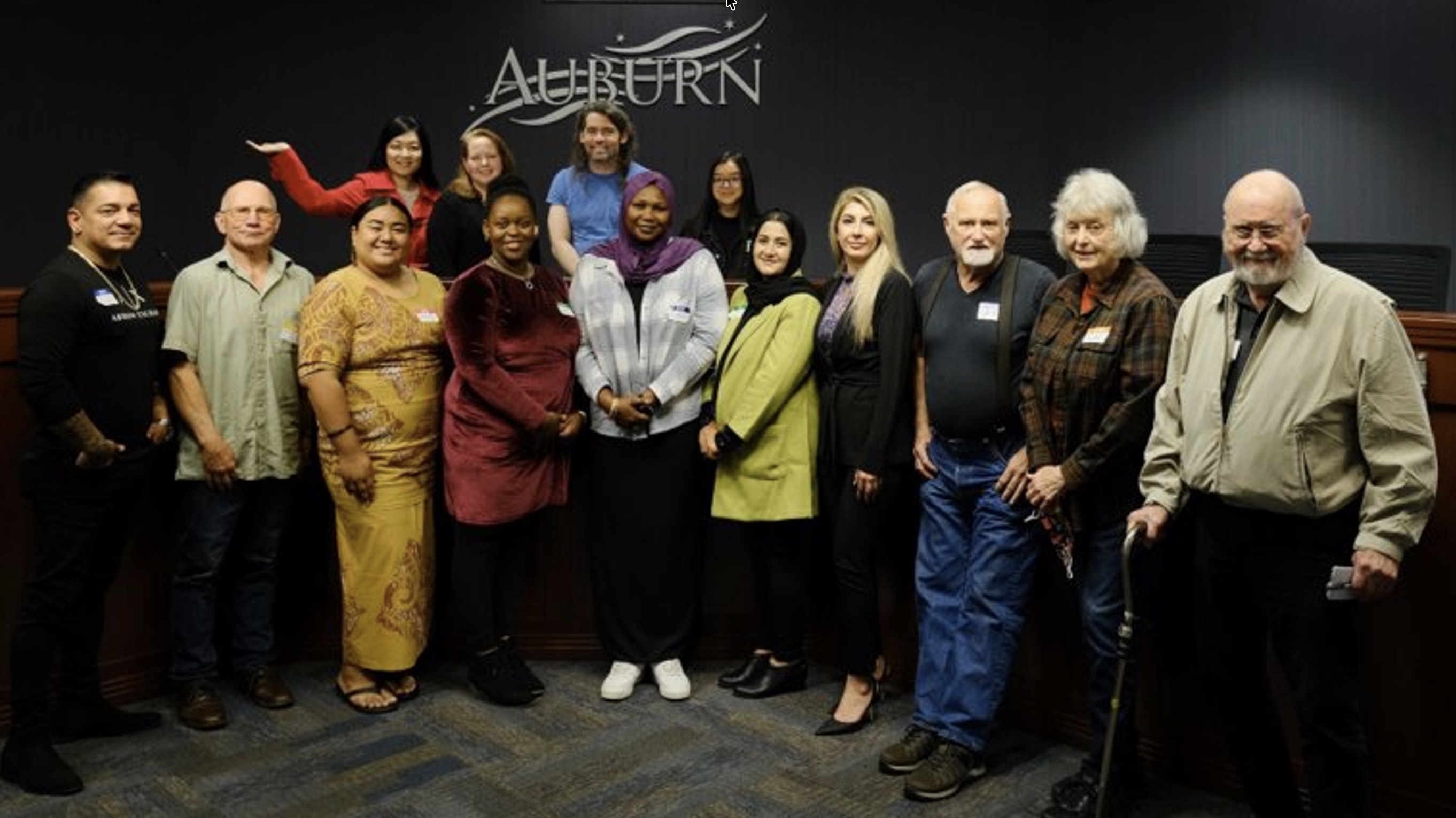 Climate and Health Adaptation Modeling Project participants group photo standing in front of the City of Auburn logo