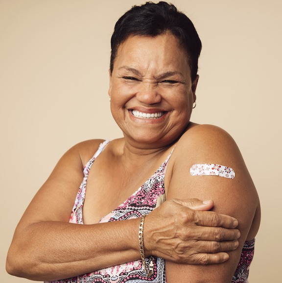 Woman smiling after getting vaccinated