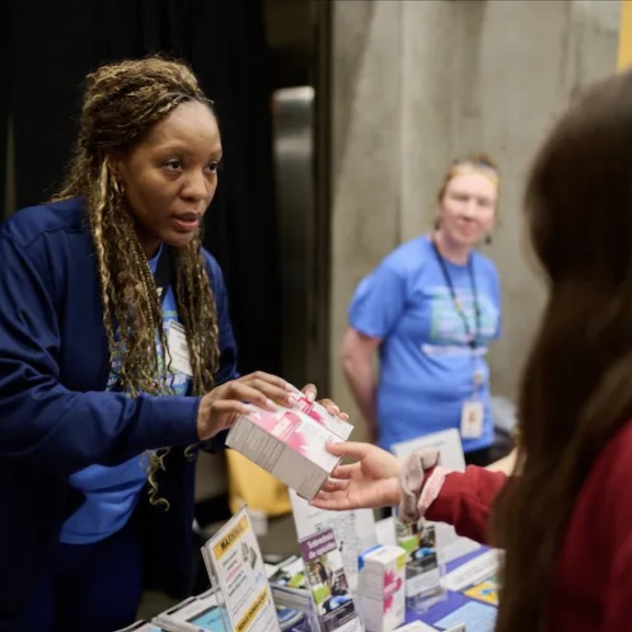 Public Health staff giving out free Naloxone at the Seattle Center's annual Free Clinic event