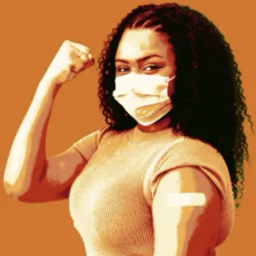 Woman posing with a raised fist to demonstrate having been empowered with vaccine.