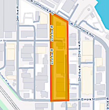 A map shows a highlighted area in orange, outlining a long, narrow block bordered by West Commodore Way, 22nd Avenue West, West Elmore Street, and 23rd Avenue West in Seattle indicating the area of lead contamination.