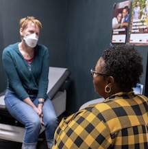Patient and provider in an exam room