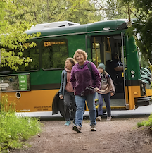 Bus passengers leaving a Metro bus to popular trailheads in King County