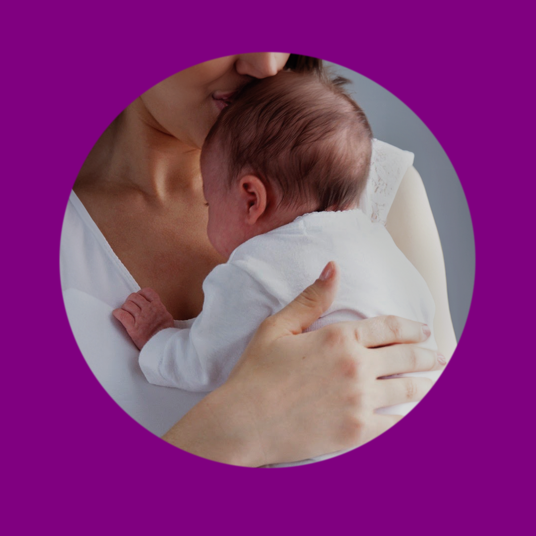 baby held by a woman.