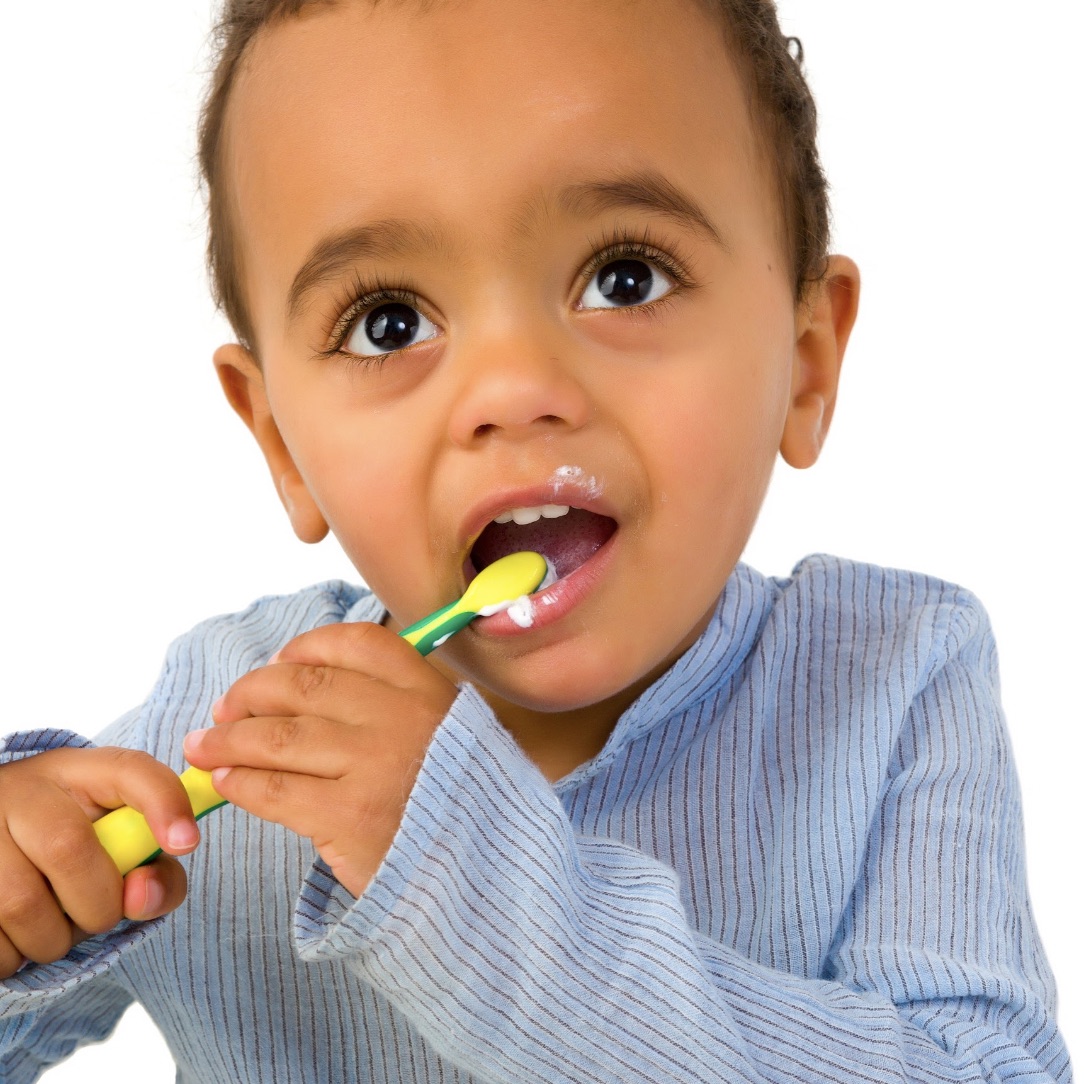 Male toddler brushing his teeth.