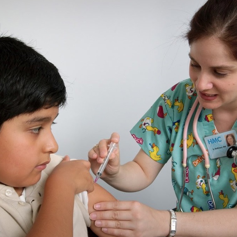 Young boy being vaccinated