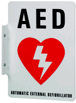 A metal sign indicating location of an AED
