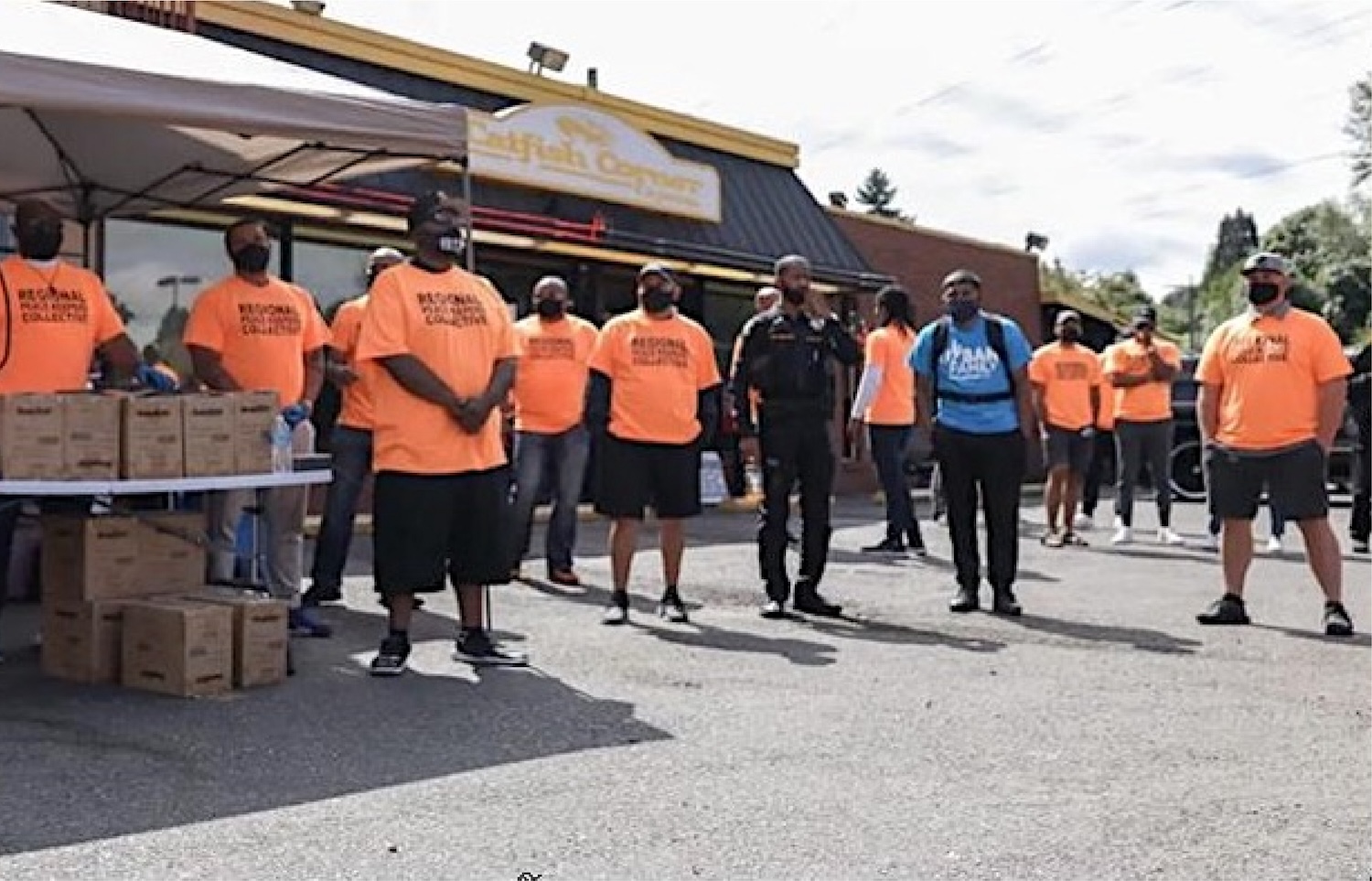 Regional Peacekeepers Collective distributes gun lockboxes during a commemorative event on National Gun Violence Awareness Day