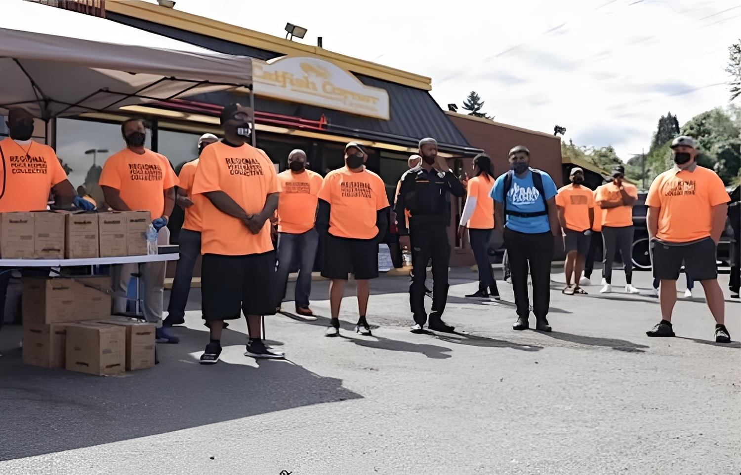 Regional Peacekeepers Collective distributes gun lockboxes during a commemorative event on National Gun Violence Awareness Day