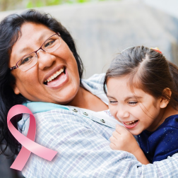 Mother and daughter with pink ribbon representing early detection with breast cancer screening