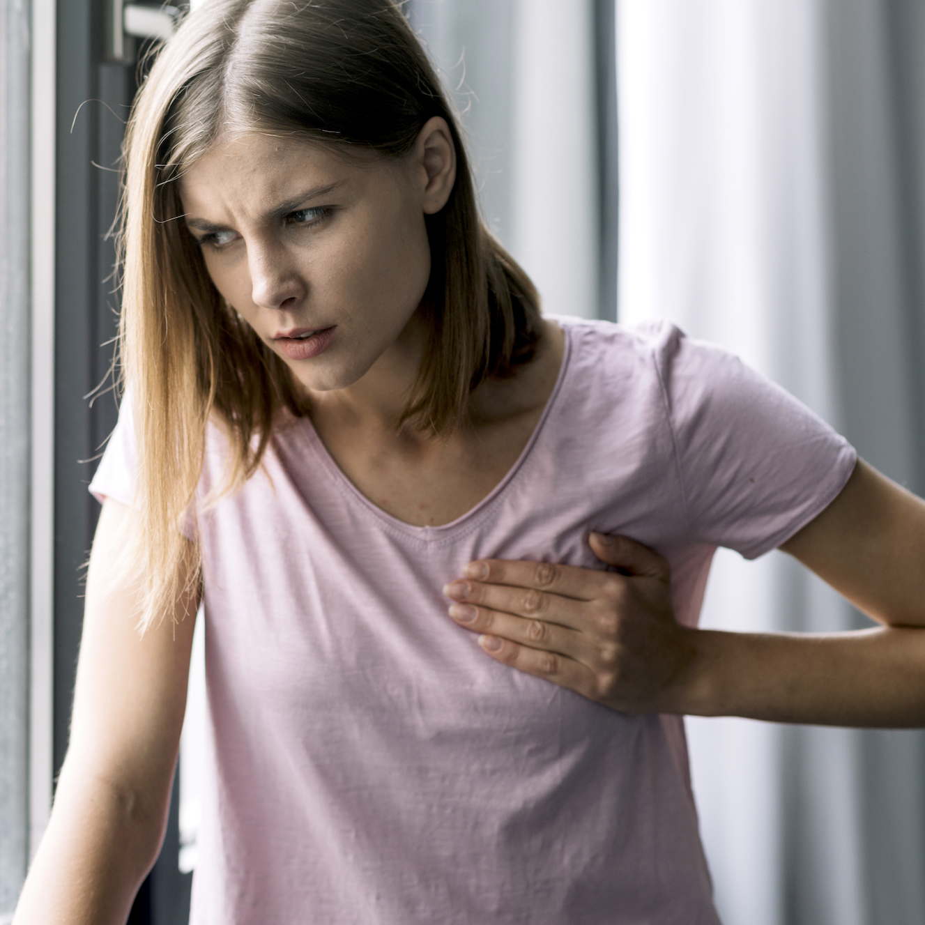 Woman experience chest pain on breast