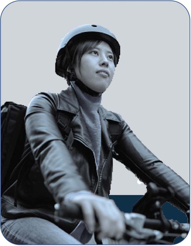Young woman riding a bike with a helmet