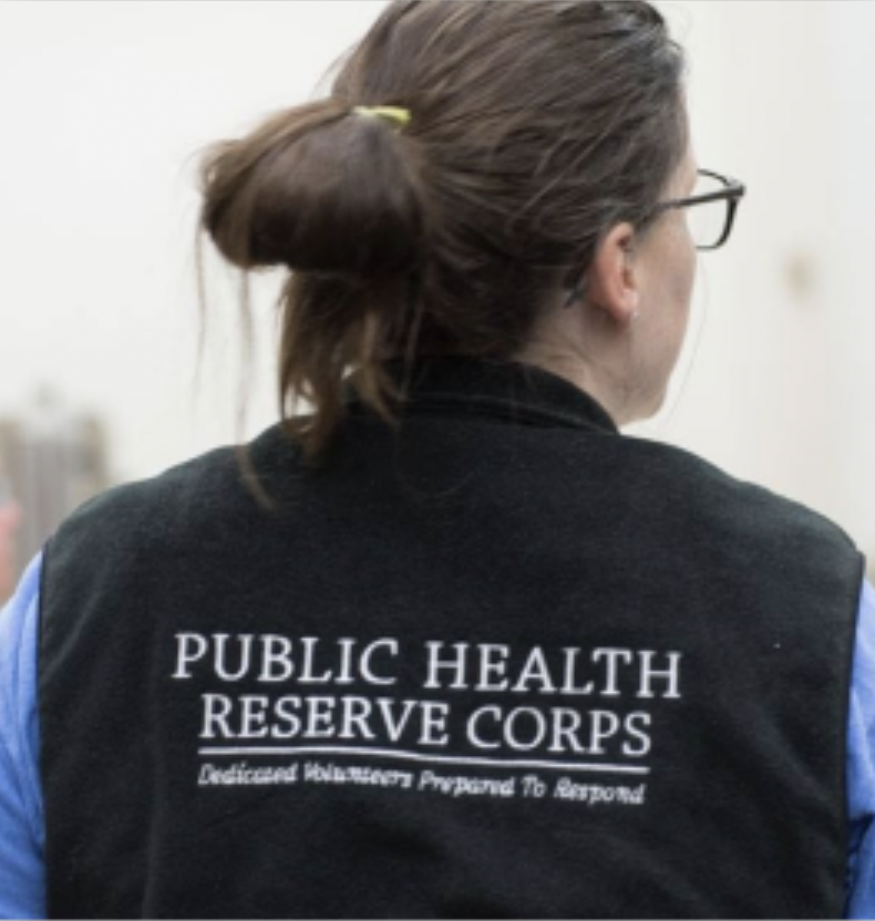 Public Health Reserve Corps volunteer wearing a PHRC vest