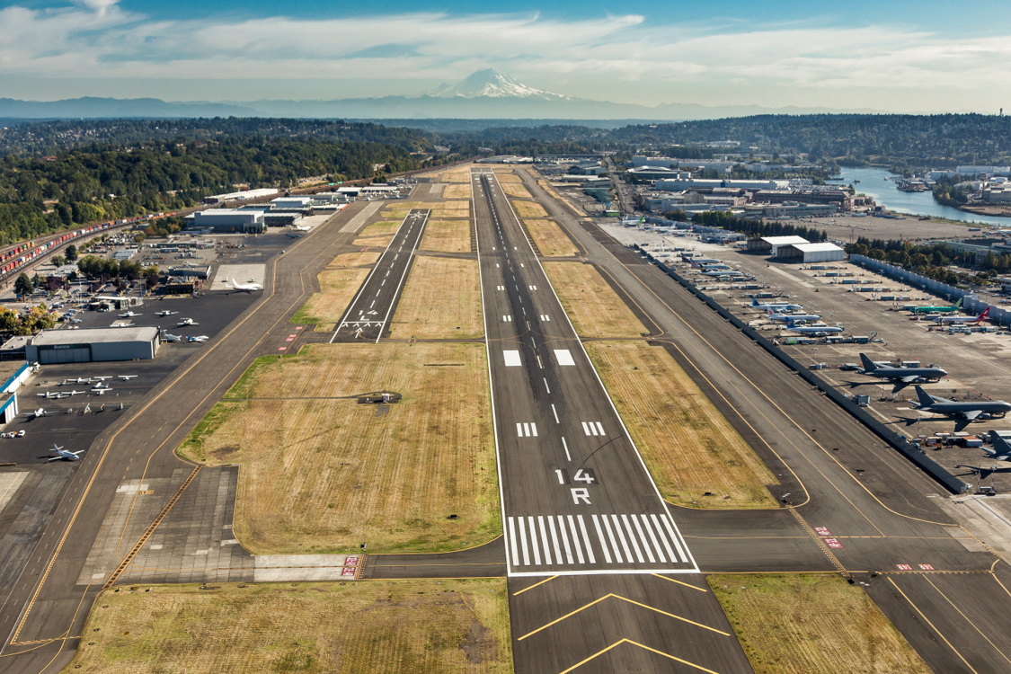 Aerial view of King County International Airport showing runways and airport buildings.