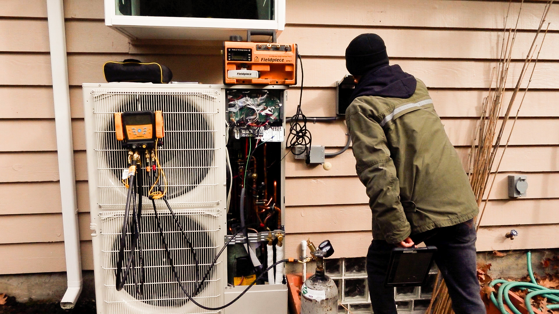 person installing heat pump