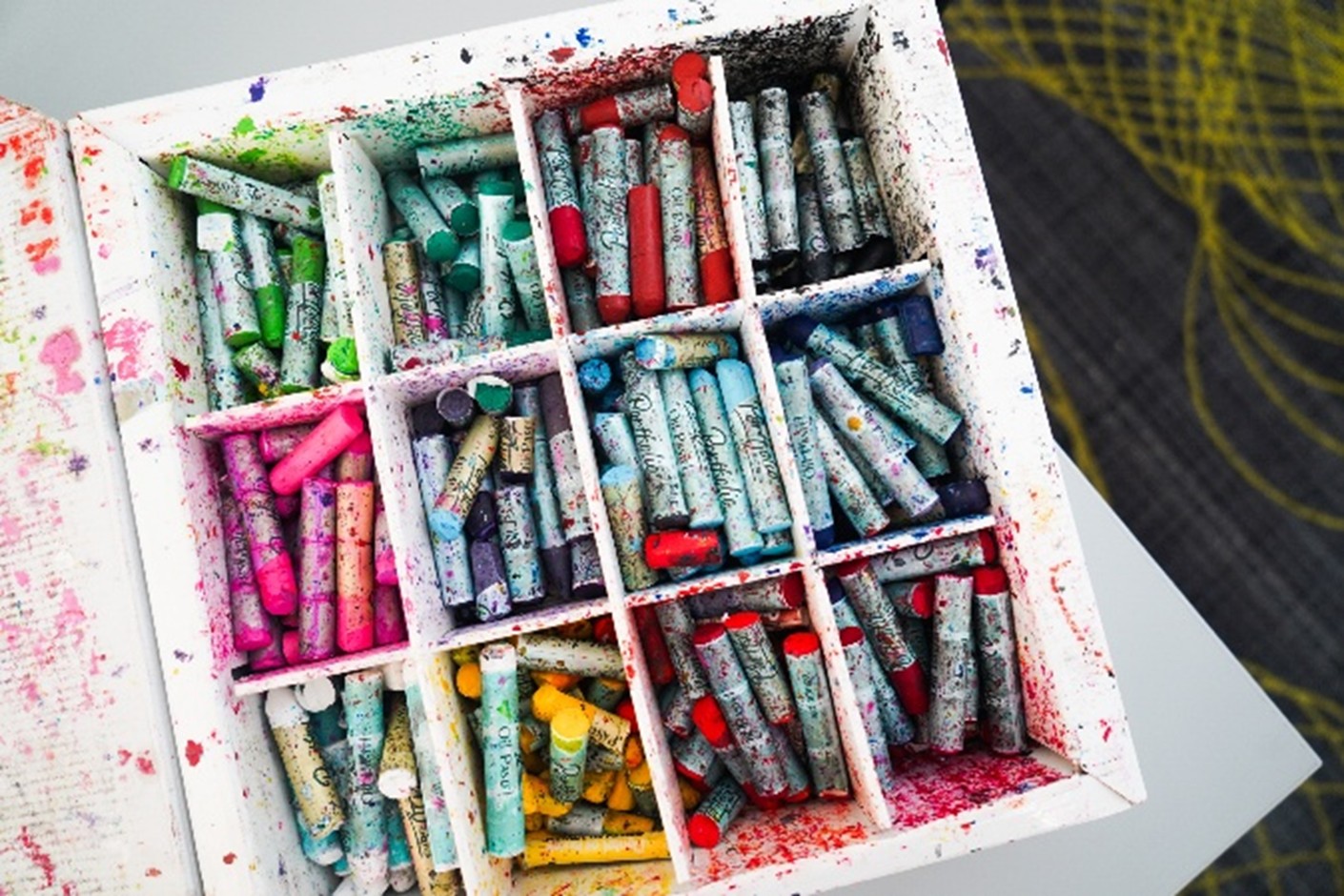 box of oil pastel crayons in various colors
