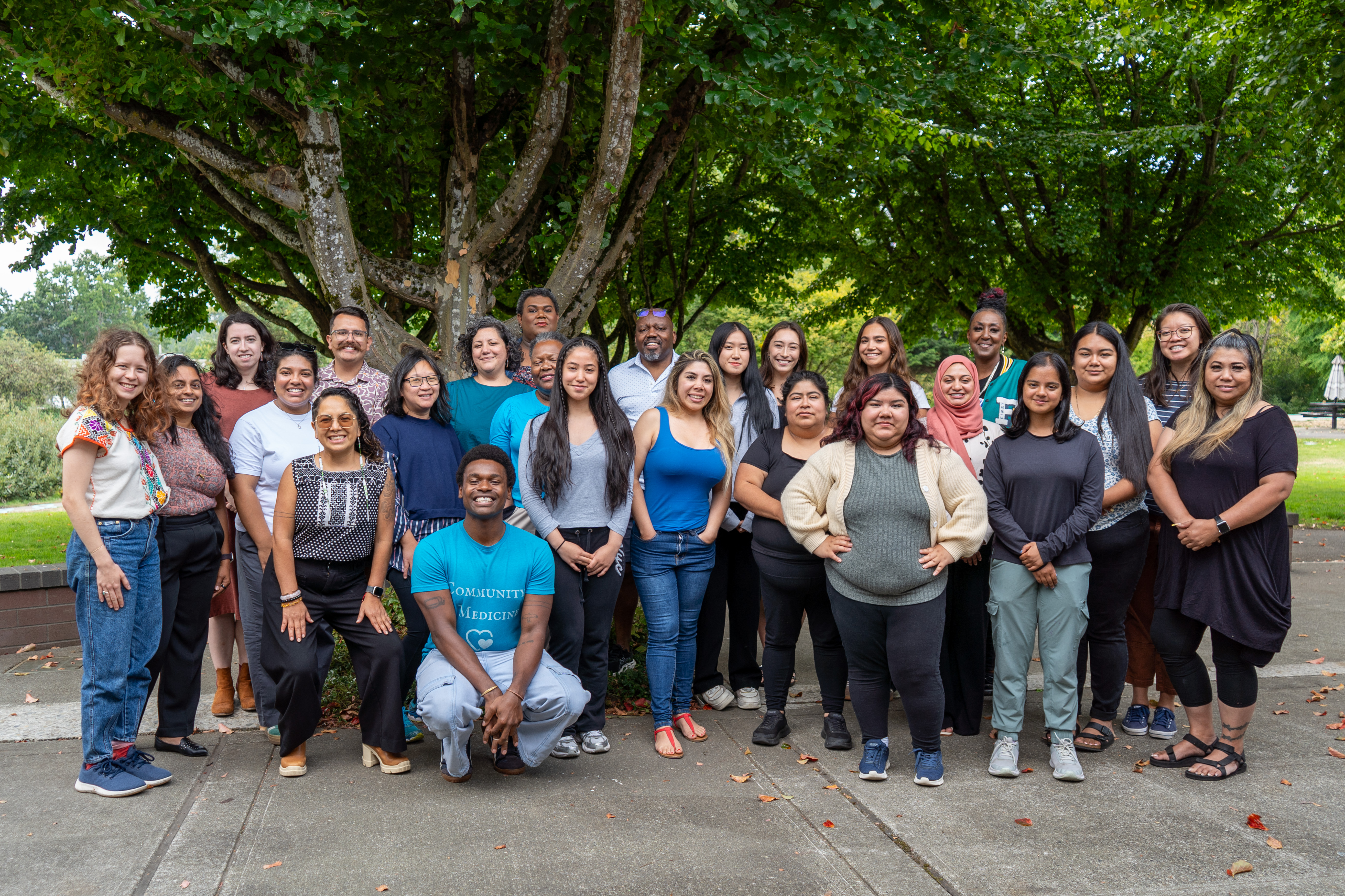 large group of people smiles for a photo, including Climate Equity Community Task Force members and community consultants