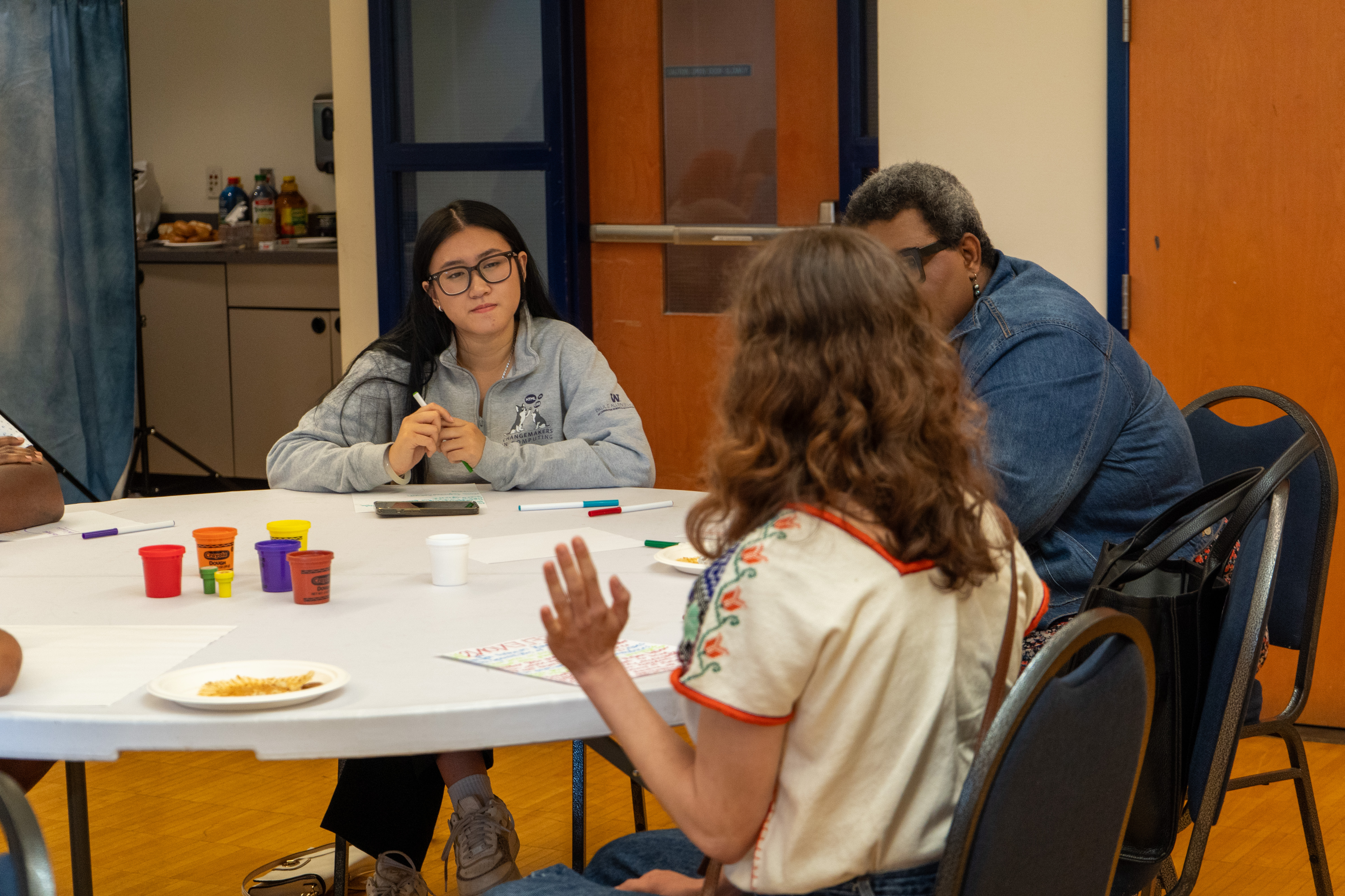 people talking during a meeting of the Climate Equity Community Task Force