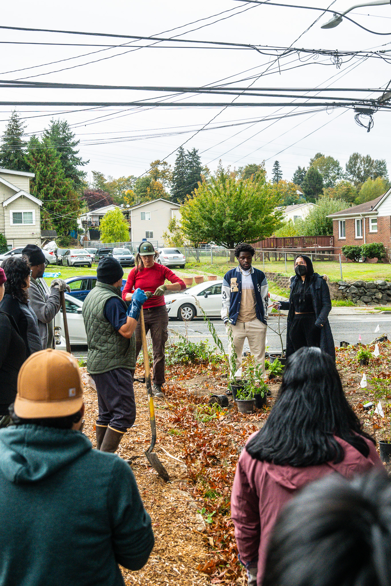 people standing in a group listening to instructions