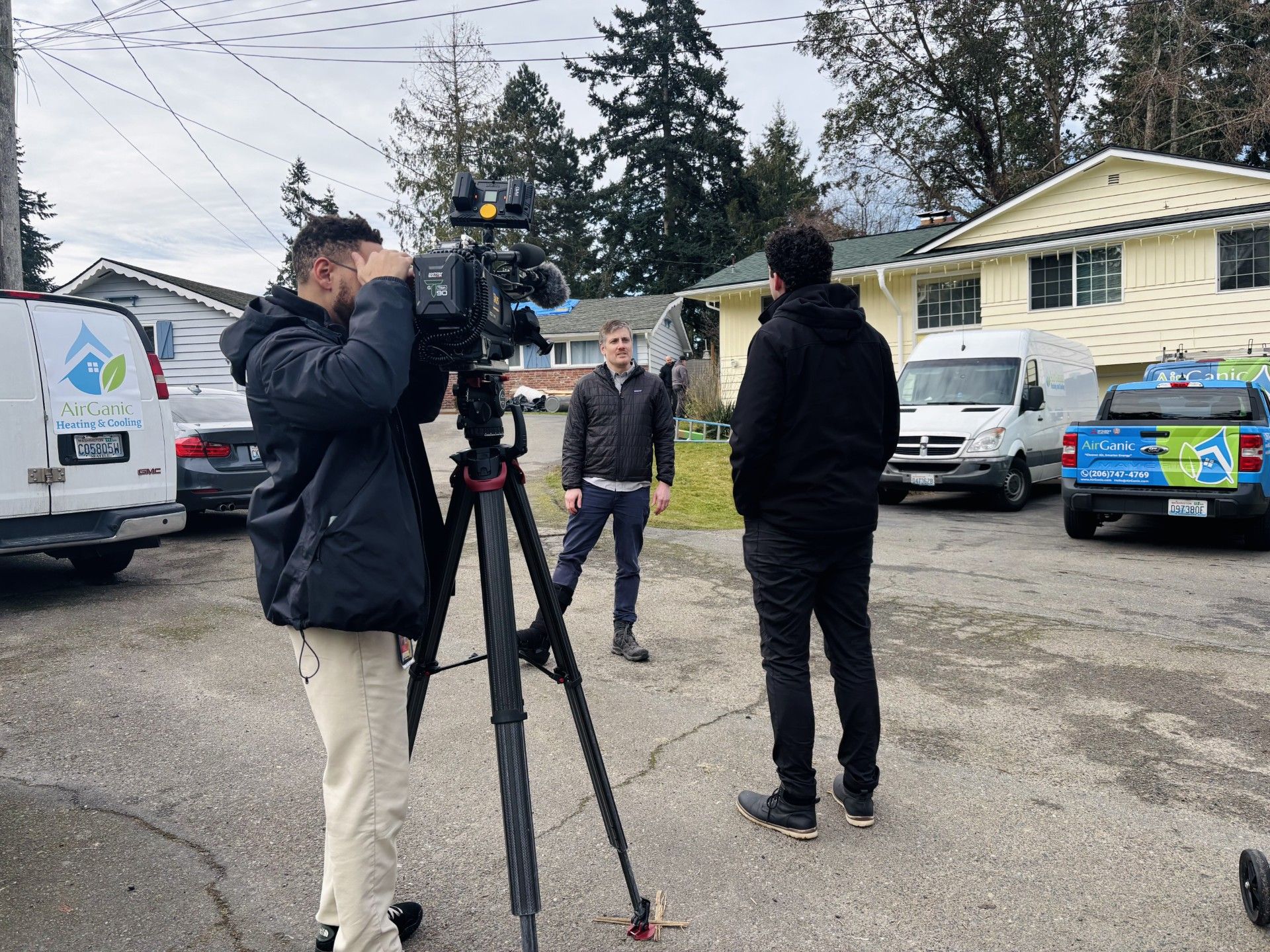 photographer with camera tapes an interview