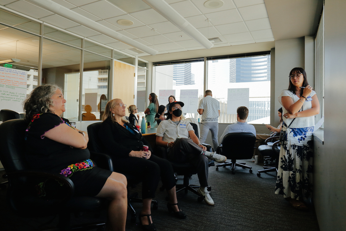 room of people listening to a speaker