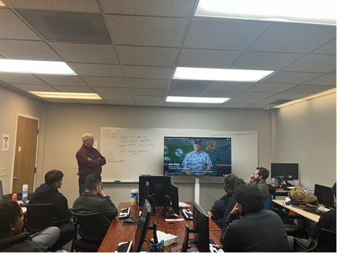 person giving presentation to group of people