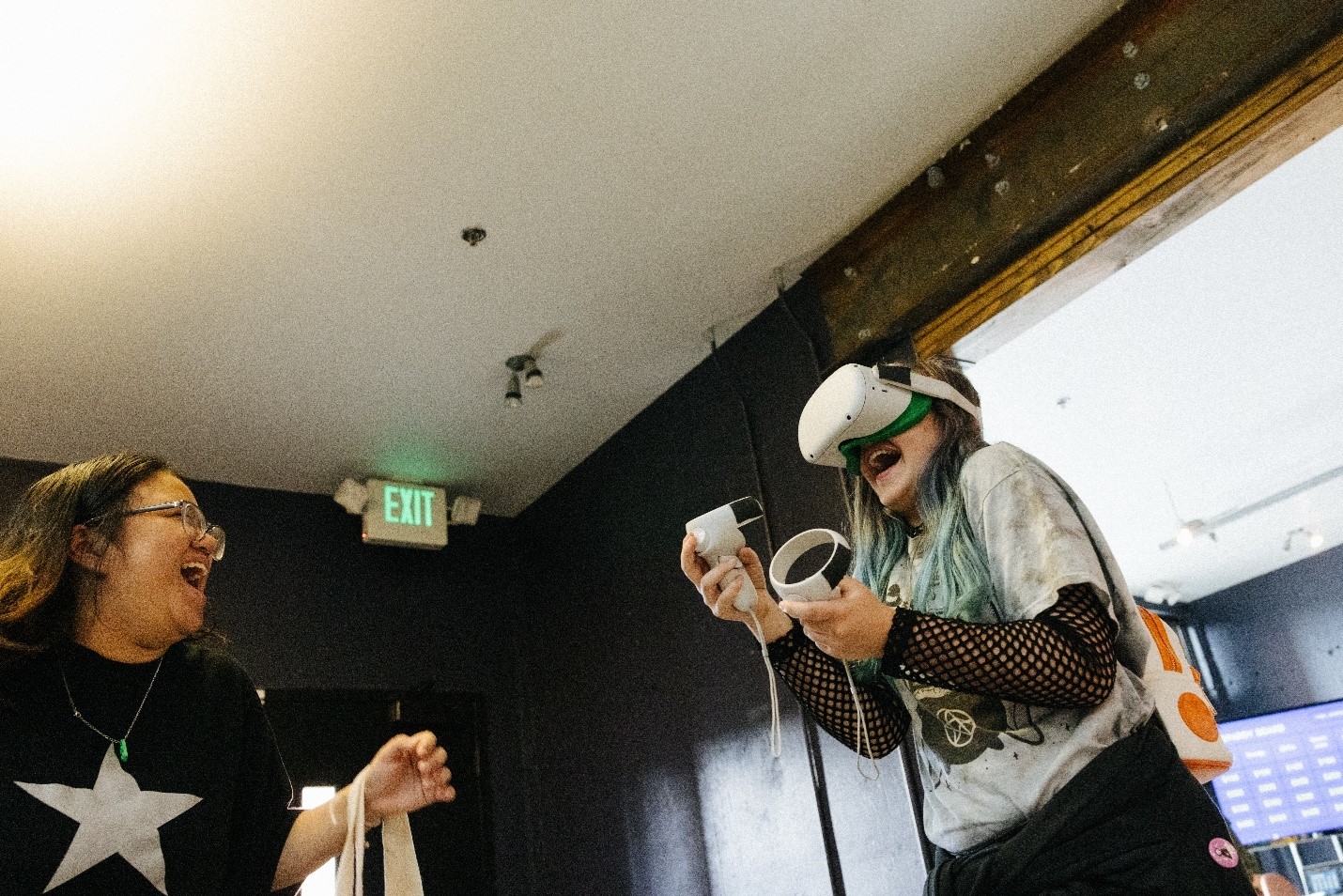 two people use virtual reality headset