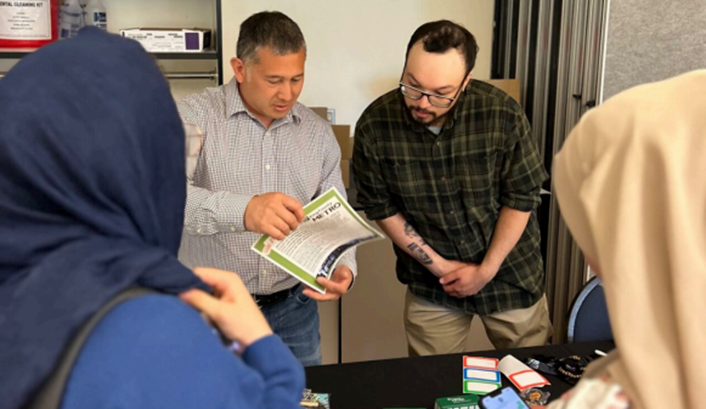 men paging through document