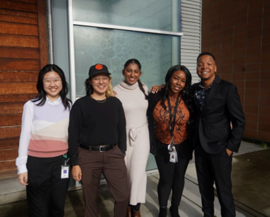 group of people smiling and posing for camera 