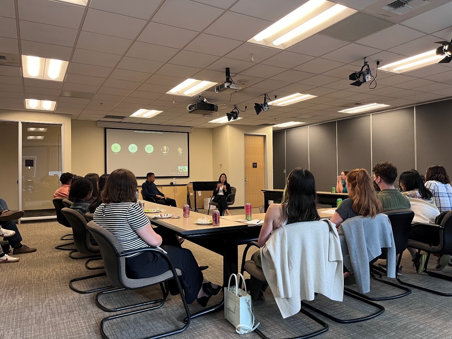 group of people sitting around table in office