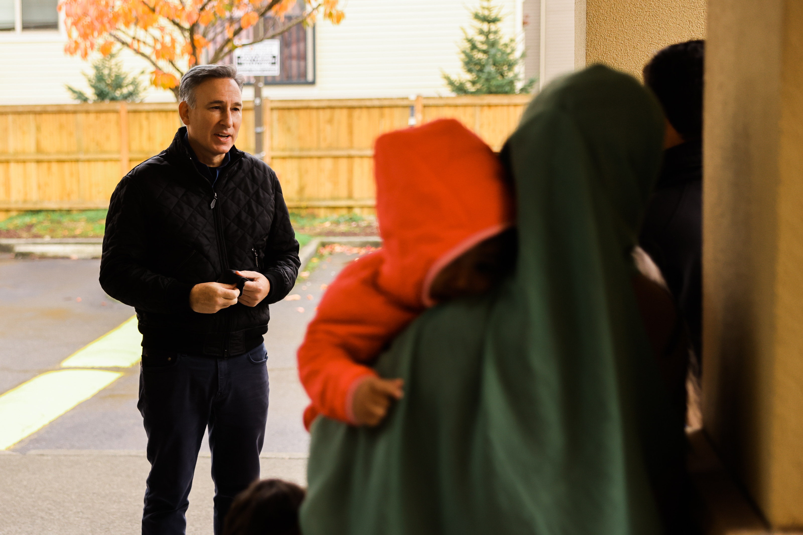 Visiting with refugee family