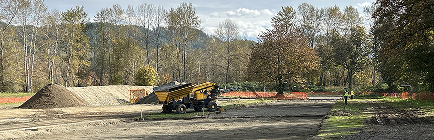 Tractor spreading topsoil