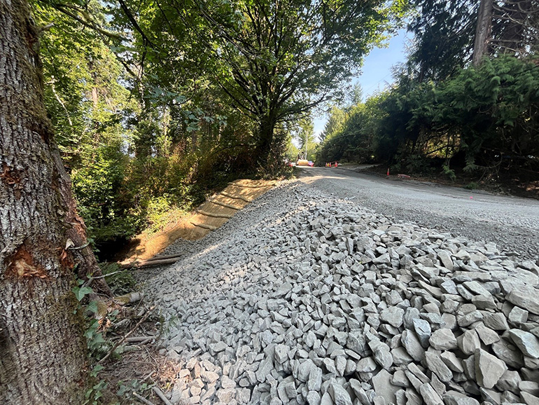 141st Avenue SW road covered in gravel and rock, prepped for paving